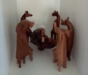 Kenya Collection Of Hand Carved Wood Animals Sitting Around A Table With Wood Beverages     Kit Wall