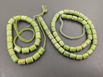 2 LOOSE STRANDS OF JADE BEADS