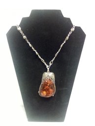 Eye-catching Amber Pendant Necklace With Silver Tone Decorative Setting & Chain