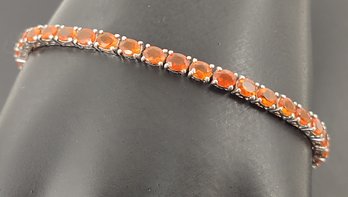 STUNNING STERLING SILVER FACETED ORANGE FIRE OPAL TENNIS BRACELET