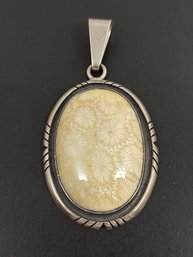 ARTISAN DESIGNER CHARLES ALBERT STERLING SILVER FOSSILIZED CORAL PENDANT