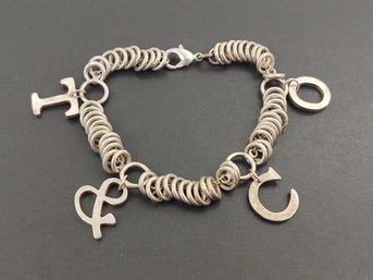 VINTAGE STERLING SILVER T & C O CHARM BRACELET