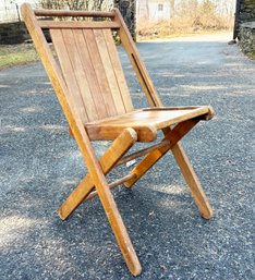 A Vintage Tuck-a-way Folding Chair
