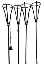 A Set Of 4 Wrought Iron Tiki Torch Holders