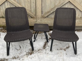 Two Low Slung Composite Wicker Chairs With Table