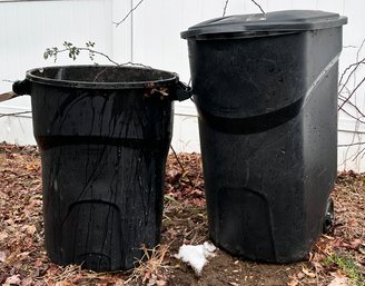 A Pair Of Plastic Trash Cans