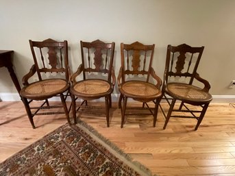 FOUR ANTIQUE WALNUT CANED CHAIRS