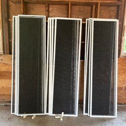 A Collection Of 12 Metal Framed Screens