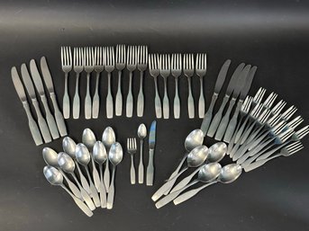 A Set Of Contemporary Flatware In Brushed Stainless Steel