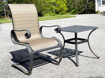 A Hampton Bay Cast Aluminum Rocker And Side Table