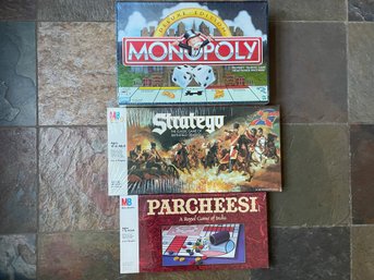 Three Vintage Sealed Board Games Including Monopoly Deluxe Ed., Parcheesi & Stratego