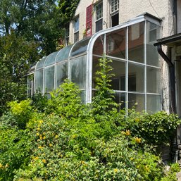 A Lord & Burnham Lean-to Aluminum And Glass Green House