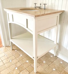A Custom Bath Vanity With Marble Top And Decolav Fittings