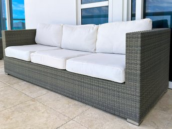 A Modern Outdoor Woven Resin Sofa By Harmonia Living