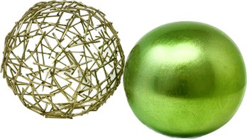 Metal Sphere Sculpture And A Green Tabletop Orb