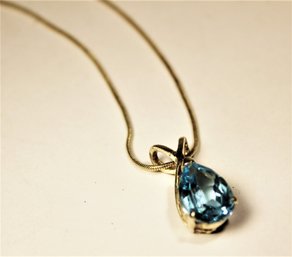 Fine Sterling Silver Chain Necklace 16' Having Large Pear Shaped Blue Topaz Stone