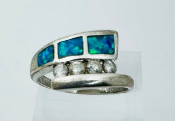 VINTAGE STERLING SILVER BLUE OPAL AND WHITE STONE BYPASS RING