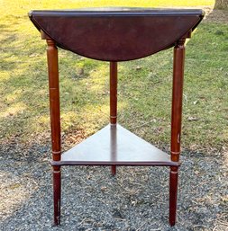 A Mahogany Triangle Drop-leaf Occasional Table