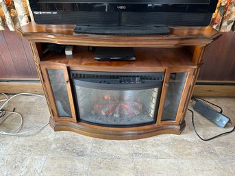 Electric Fireplace In Two Door Cabinet And Shelf