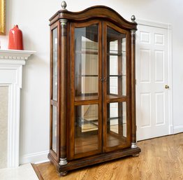 A Large Glass Paneled China Or Curio Cabinet In Plantation Style