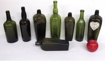 A Group Of Black Glass Case Gins And Wine Bottles Early 1900's