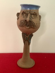 CHARACTER POTTERY STEMMED MUG