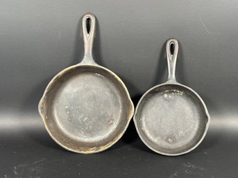 A Pair Of Vintage Cast-Iron Skillets