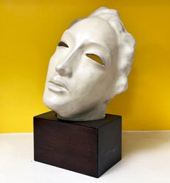 A Vintage Ceramic Mask On Mahogny Base