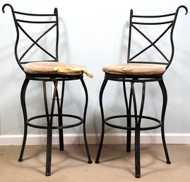 A Pair Of Wrought Iron Swivel Bar Stools