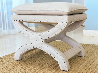 An Upholstered Stool Or Vanity Seat In Natural Linen By Restoration Hardware