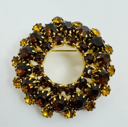 VINTAGE GOLD TONE YELLOW AND AMBER RHINESTONE CIRCLE BROOCH