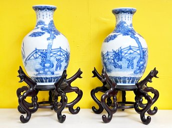 A Pair Of Antique Blue Glazed Chinese Vases On Carved Wood Vases