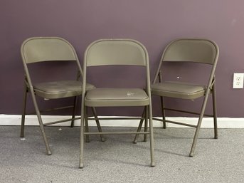 Three Classic Metal Folding Chairs With Padded Vinyl Seats