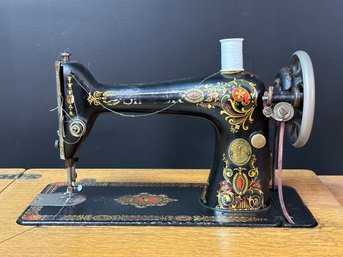 An Ornate Antique Treadle Sewing Machine By Singer