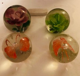 Four Vintage Glass Paper Weights