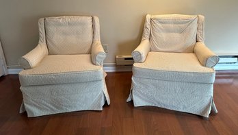 Pair Of Cream Swivel Club Chairs