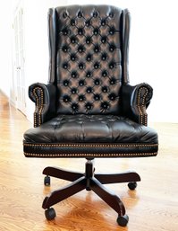 A Leather Executive Chair With Brass Nailhead Trim