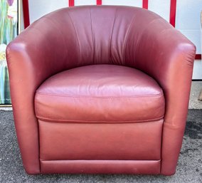 An Italian Leather Swivel Club Chair In Cordovan By Natuzzi