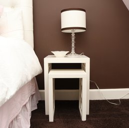 Pair Of White Contemporary  Nesting Side Tables With Open Circle Panel Sides And Lamp