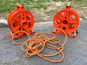 A Pair Of Long Extension Cords On Cord Wheels