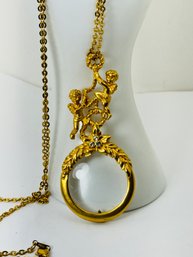 VINTAGE AVON CHERUB MAGNIFYING NECKLACE GOLD TONE