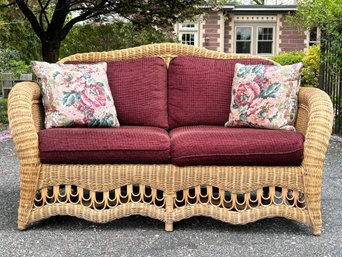 A Vintage Wicker Loveseat By Ethan Allen