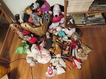 A Large Assortment Of Vintage Dolls And Stuffed Animals