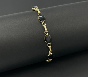 14k Yellow Gold Fancy Oval Cut Black Onyx Stations Bracelet