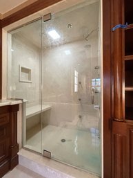 A Frameless Glass Shower Enclosure - Polished Nickel Hardware