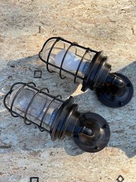 A Pair Of Caged Metal Bronze Finish Nautical Sconces