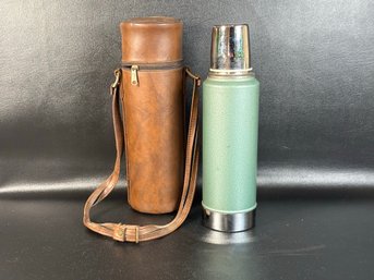 A Vintage Aladdin Stanley Thermos In Classic Green With Carrying Case