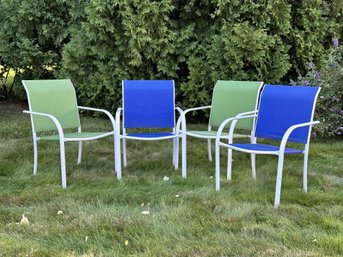 A Set Of Four Stackable Outdoor Chairs With Steel Frames & Mesh Fabric