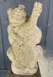 Concrete Yard Statue Of A Frog Playing The Cello