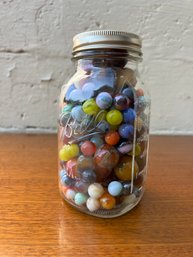 Large Glass Jar Of Marbles